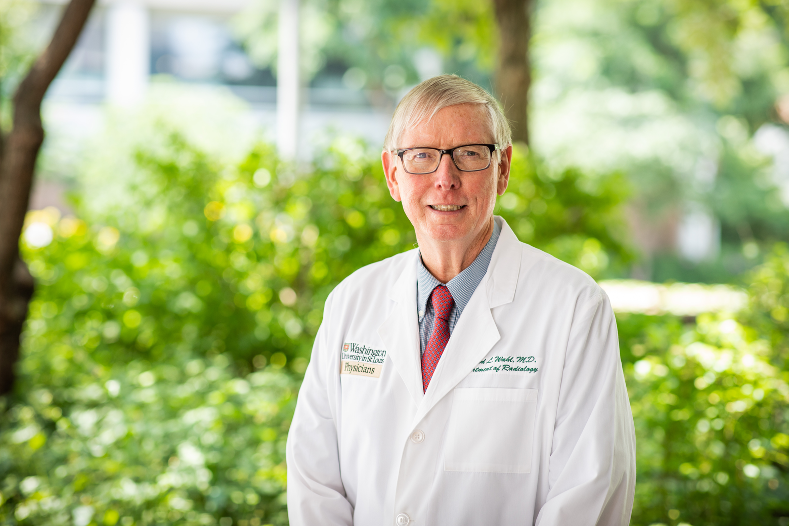 Dr. Richard Wahl, Director of Mallinckrodt Institute of Radiology, posing for a portrait on a summer day in Hope Plaza on the Washington University School of Medicine Campus.