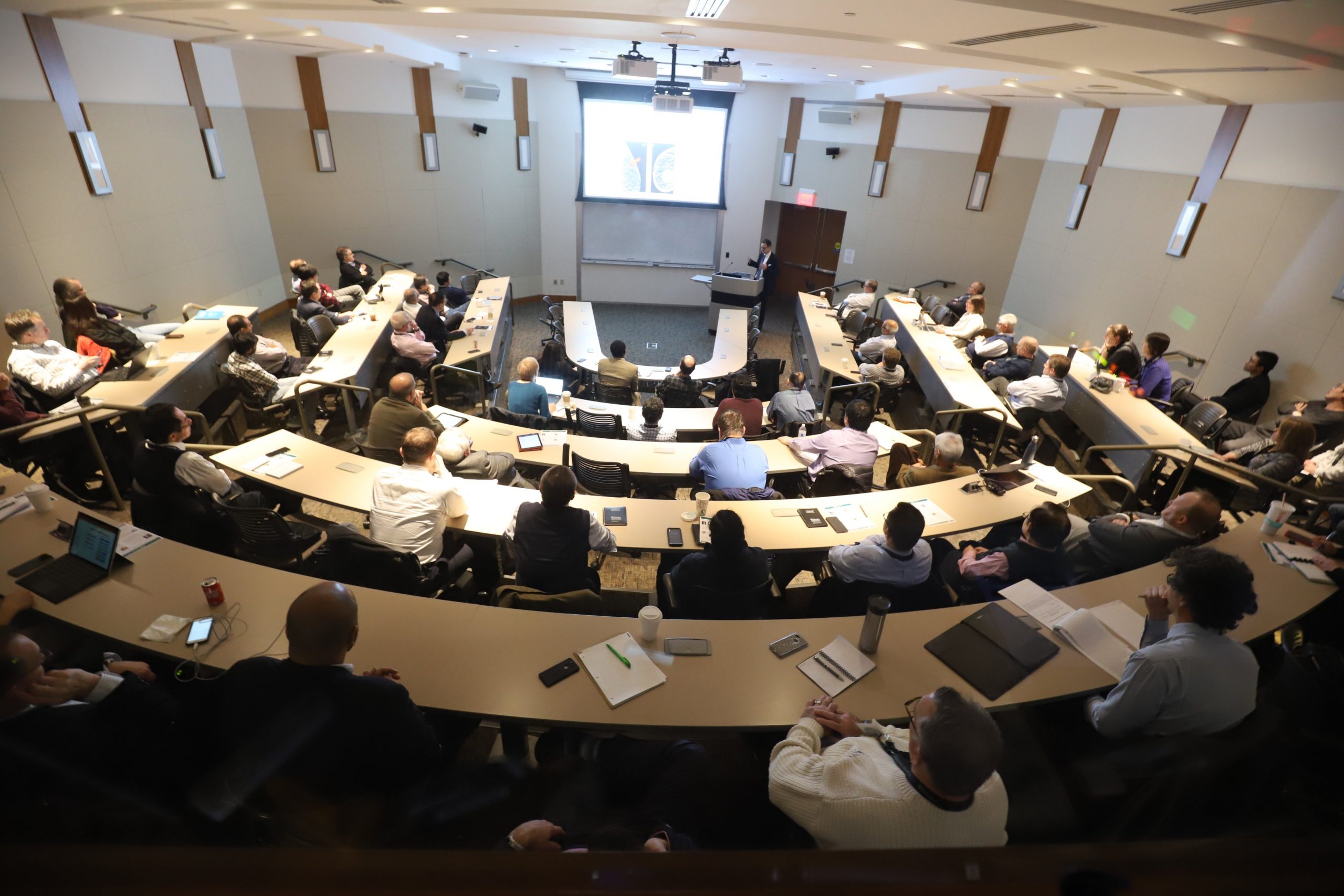Attendees fill a lecture hall to watch PET Radiotracer Translation and Resource Center's Annual Workshop and Scientific Session.