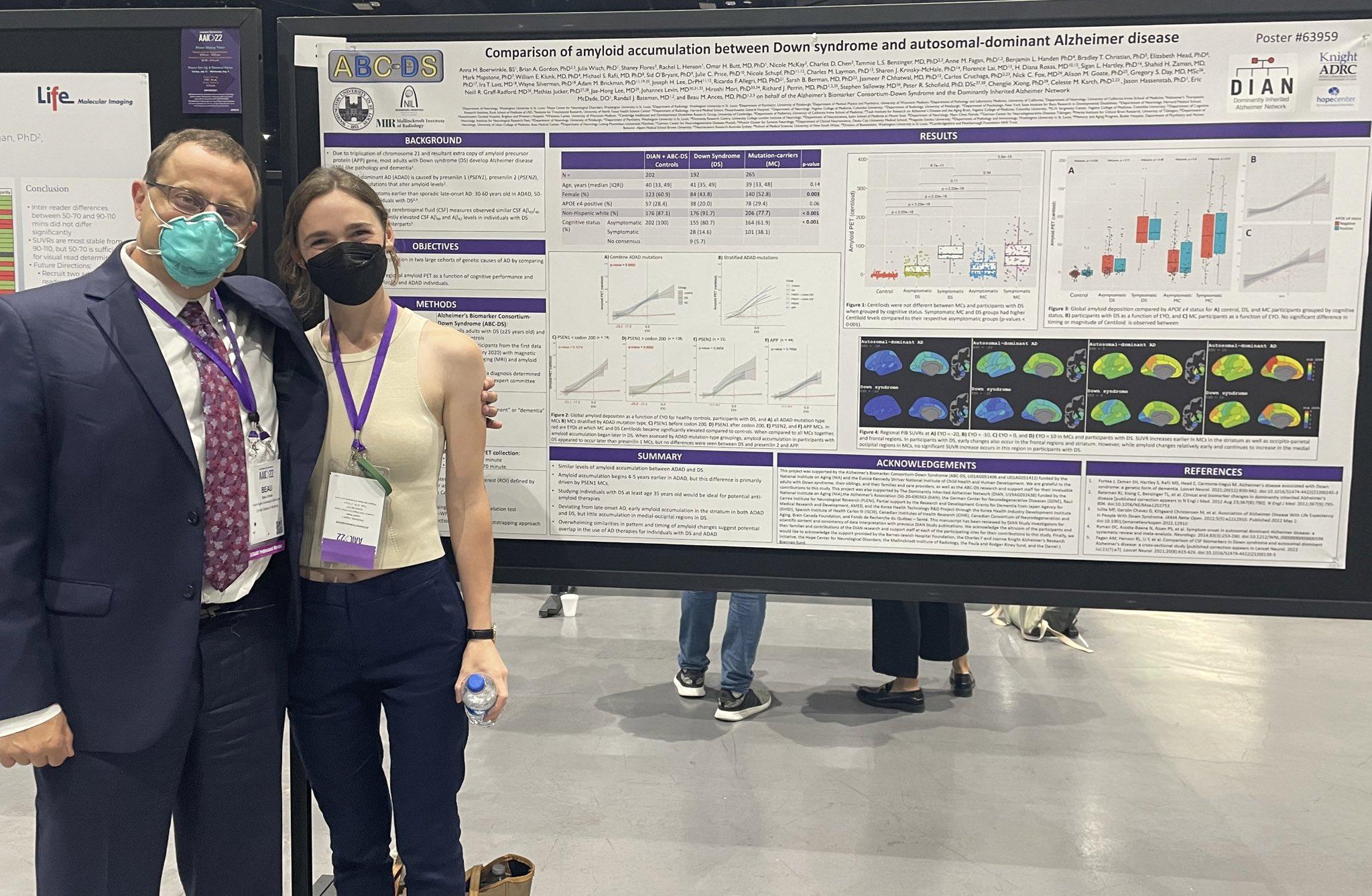 Anna Boerwinkle and Beau Ances, MD, PhD, professor of neurology and radiology, stand in front of a poster at the Alzheimer's Association International Conference.