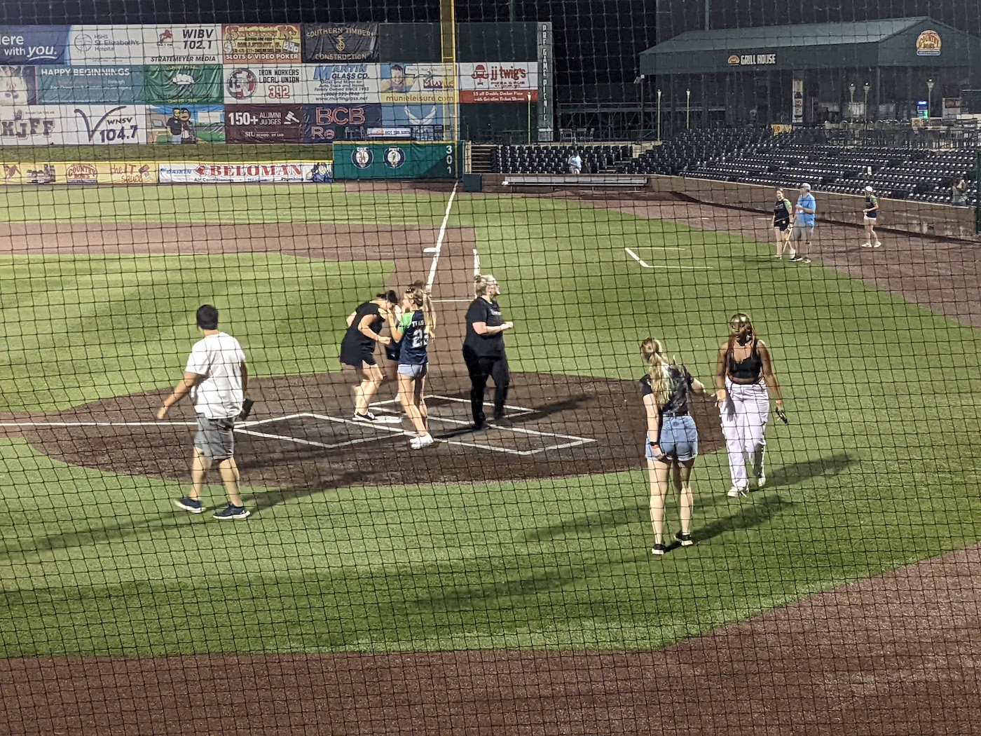 A group of Benzinger lab members cross home plate at GCS Credit Union Ballpark.
