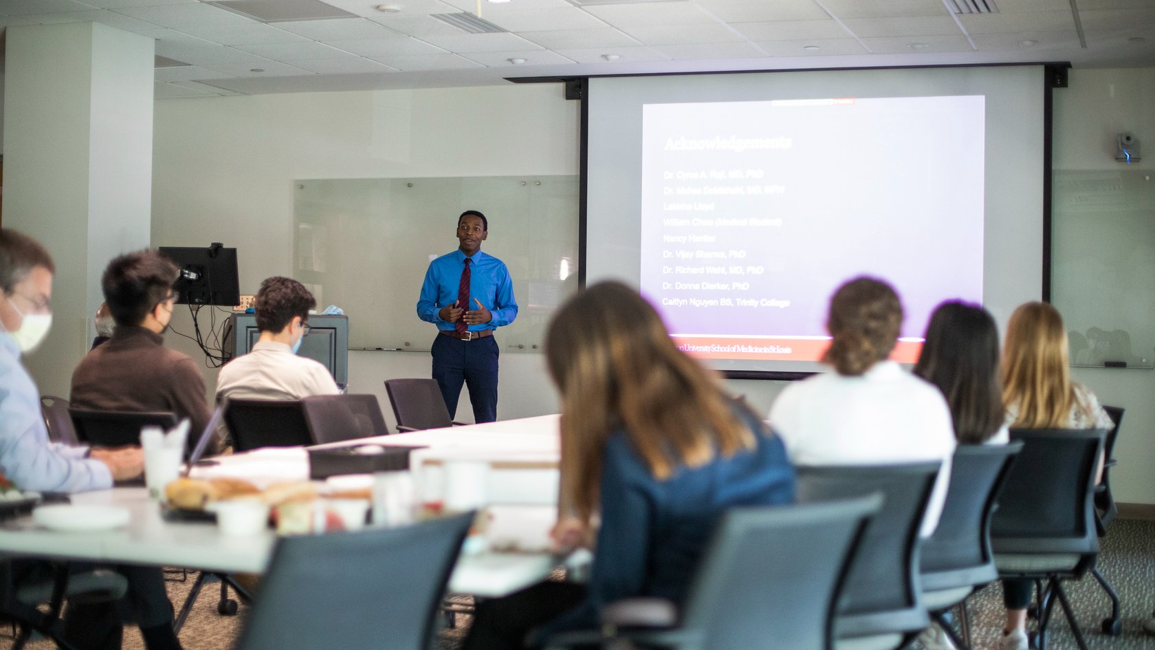Joshua Ward, a participant in the Summer Research Program, presents his research project.