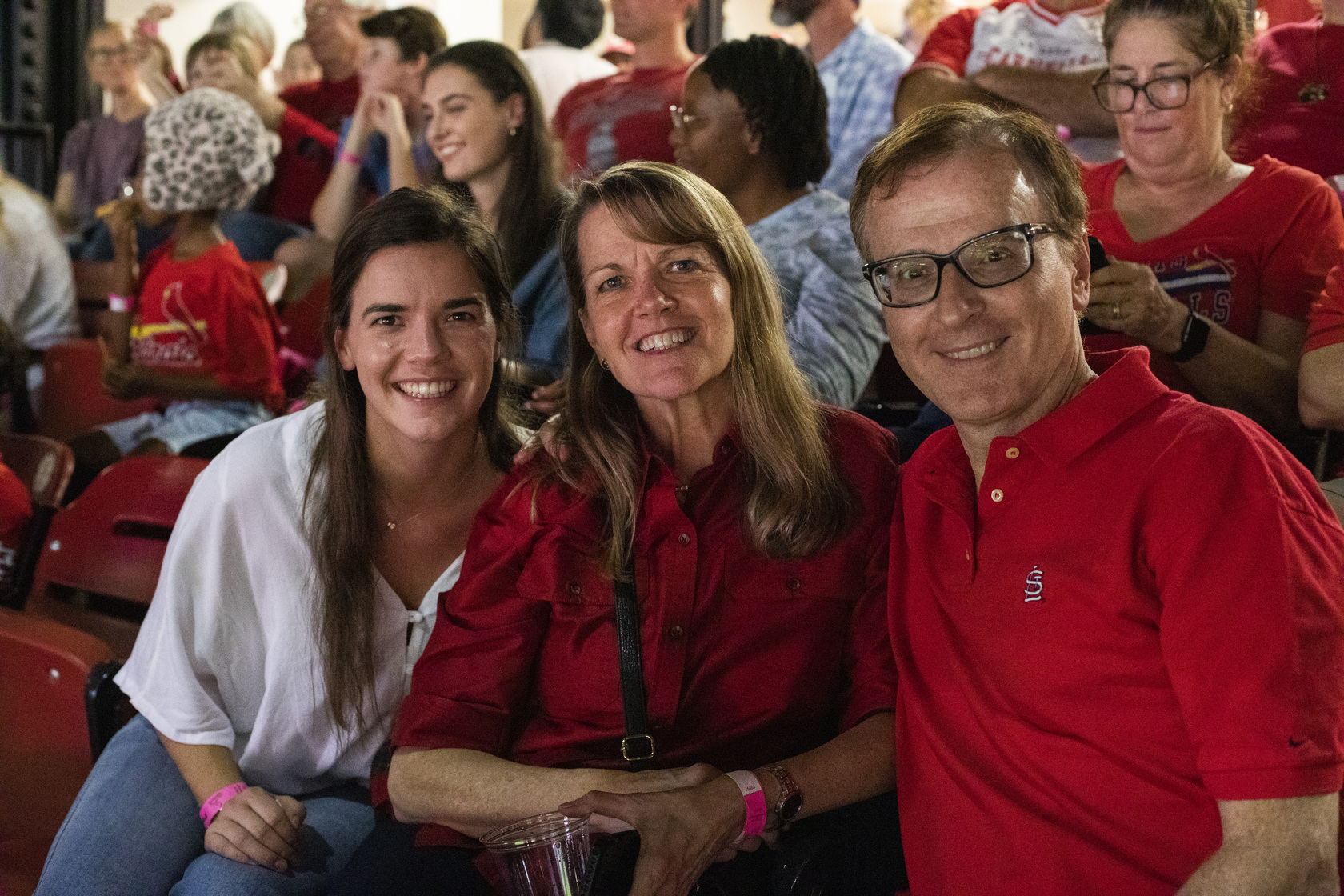 MIR faculty, trainees and families mingle at a party suite in Busch Stadium for a Cardinals game.