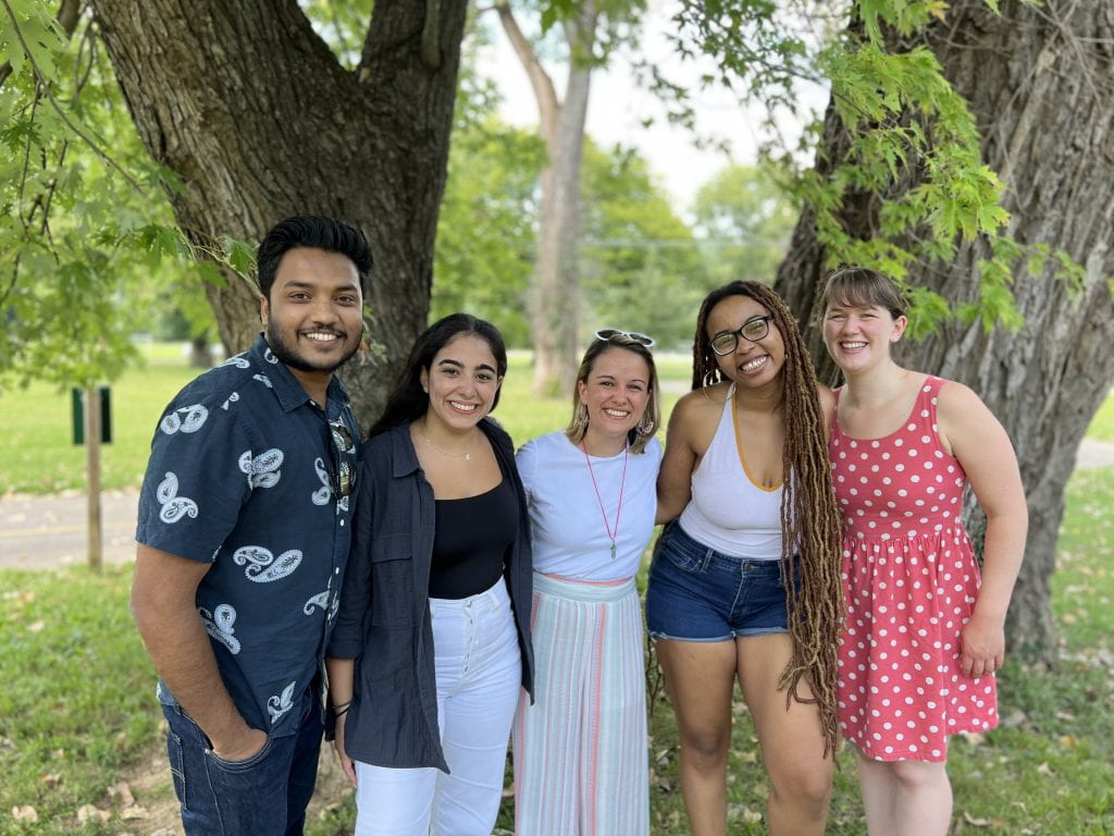 Members of the Ribeiro Pereira Lab smile for a group photo at the PRTC picnic