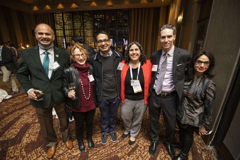 A group of alumni smile and pose for a photo at the MIR at RSNA Reception during the Radiological Society of North America's 2021 Annual Meeting in Chicago, Illinois.