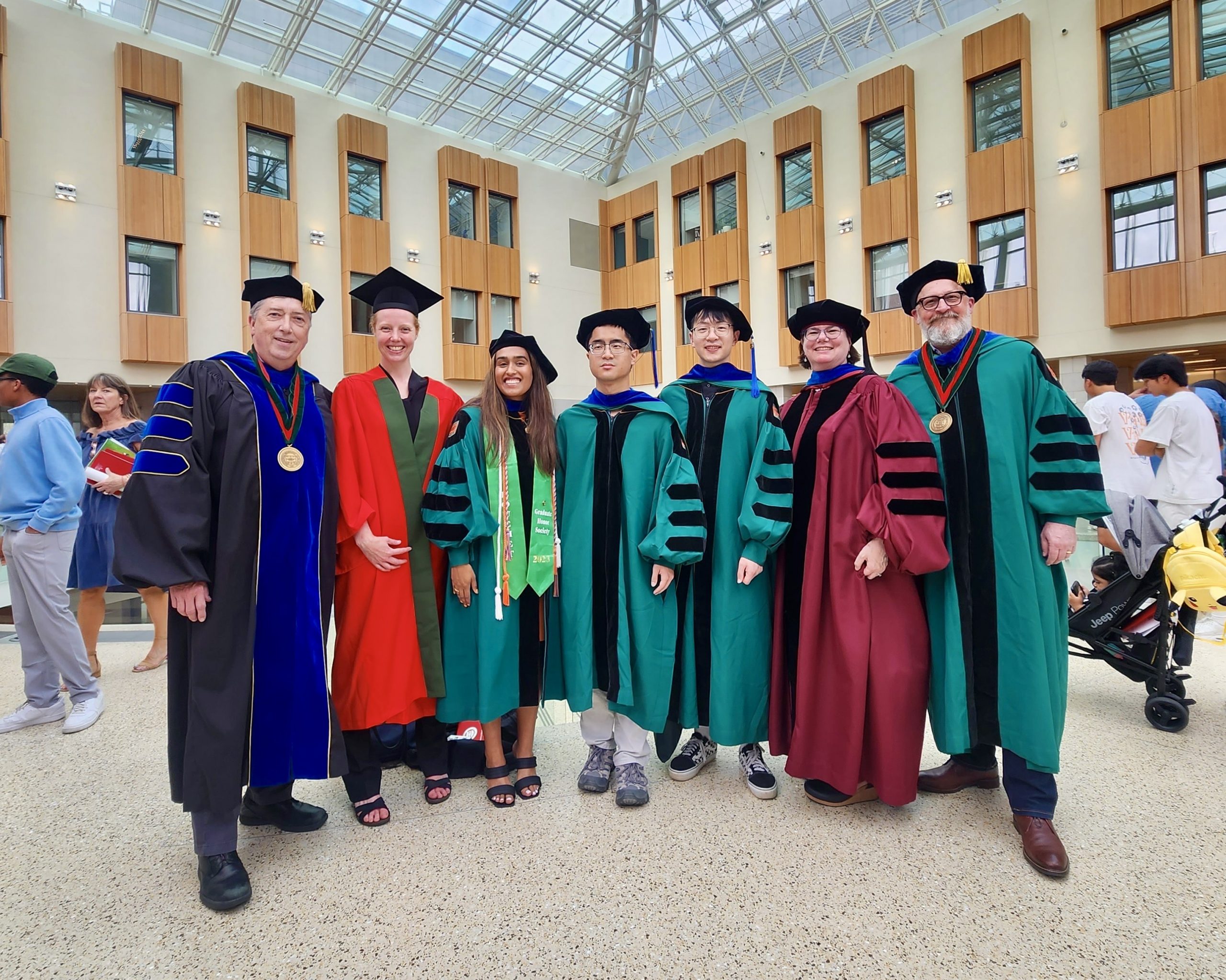 WashU faculty and graduates in graduation robes