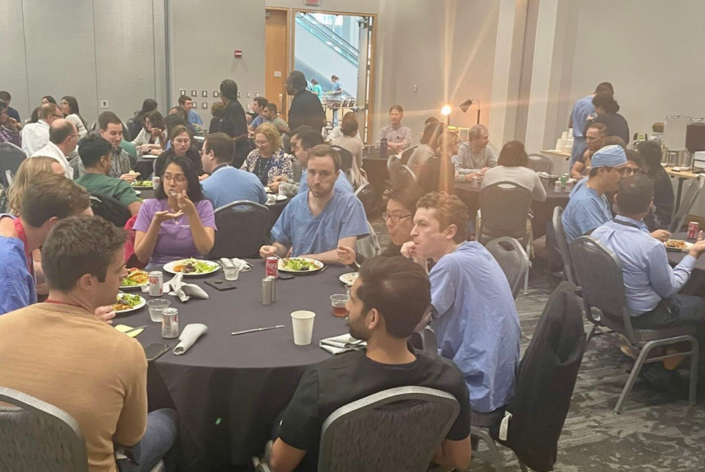Residents and fellows eat lunch in the Eric P. Newman Education Center at the annual Mallinckrodt Institute of Radiology welcome lunch.