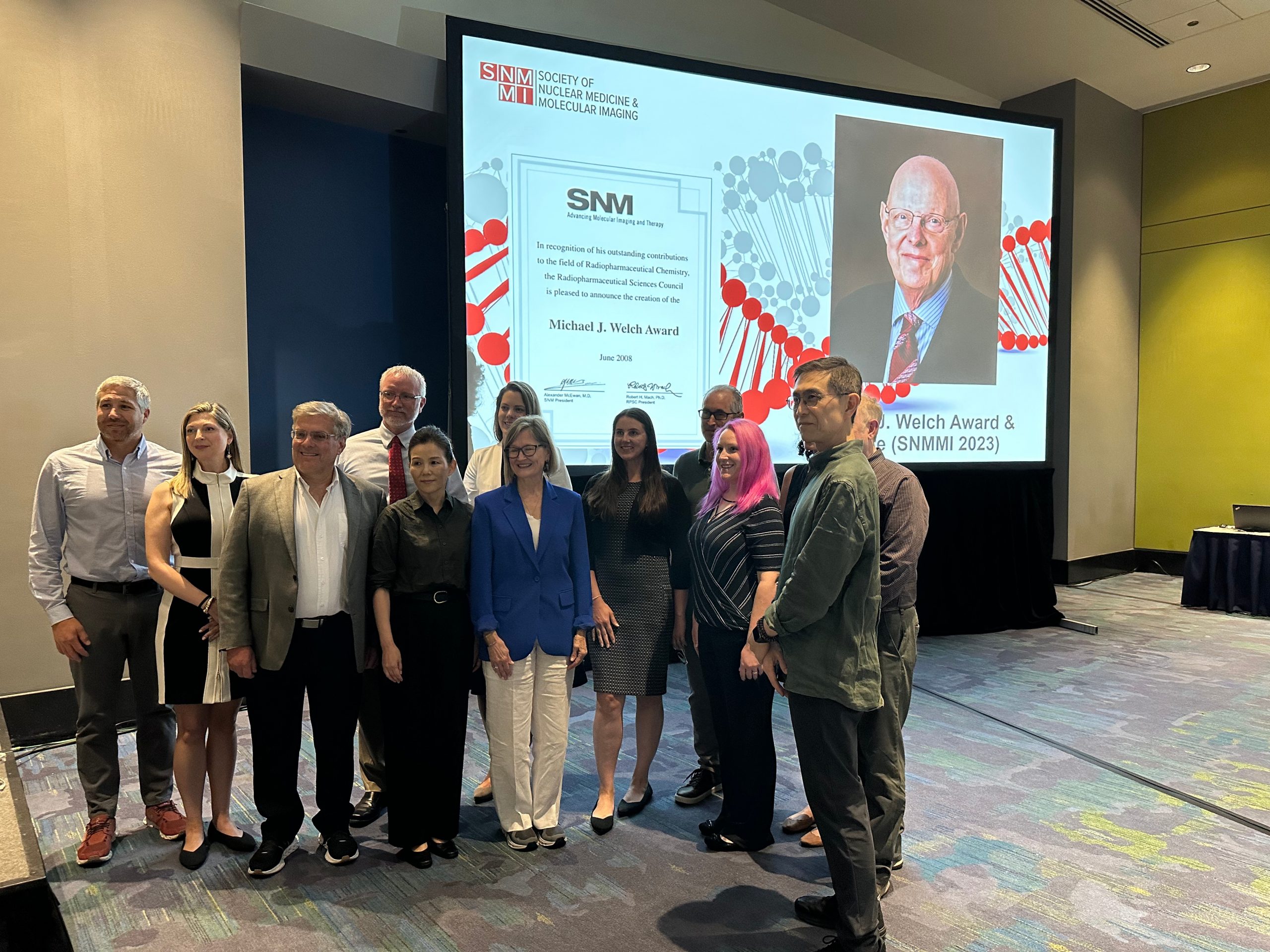 A group photo at SNMMI Annual Meeting in celebration of Sally Schwarz receiving the Michael J Welch Award.