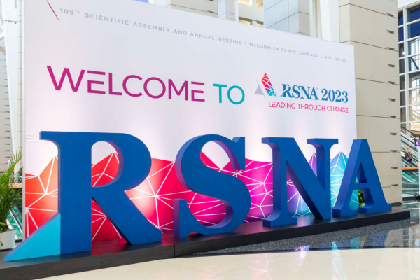 A sign reading "Welcome to RSNA 2023: Leading Through Change" with large letter props sits in the main entrance hall at the Radiological Society of North America's 109th Scientific Assembly and Annual Meeting at McCormick Place in Chicago, Illinois.