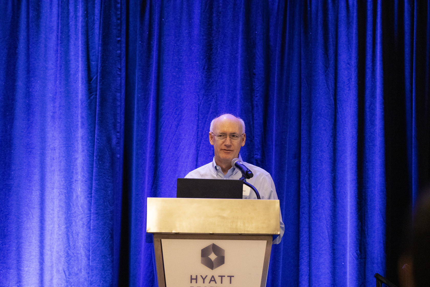 David W. Piston, PhD, stands at a podium and delivers his keynote speech.